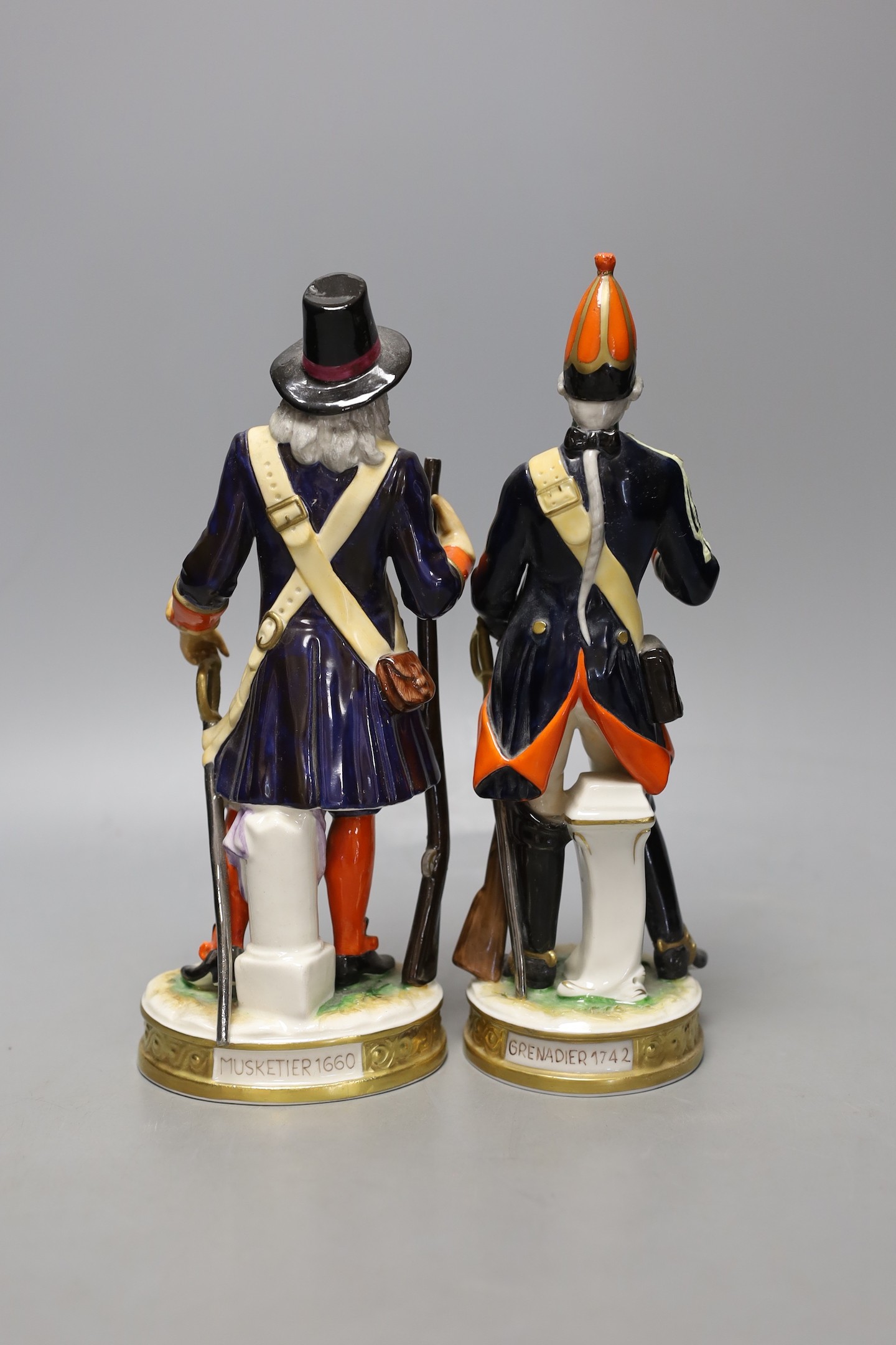 A pair of Continental porcelain military figures - tallest 25cm